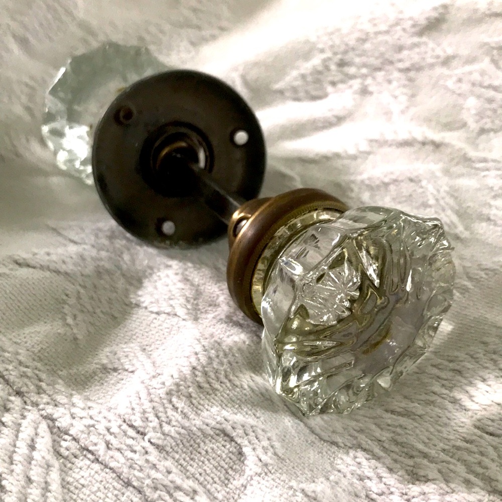 Antique glass and brass doorknobs